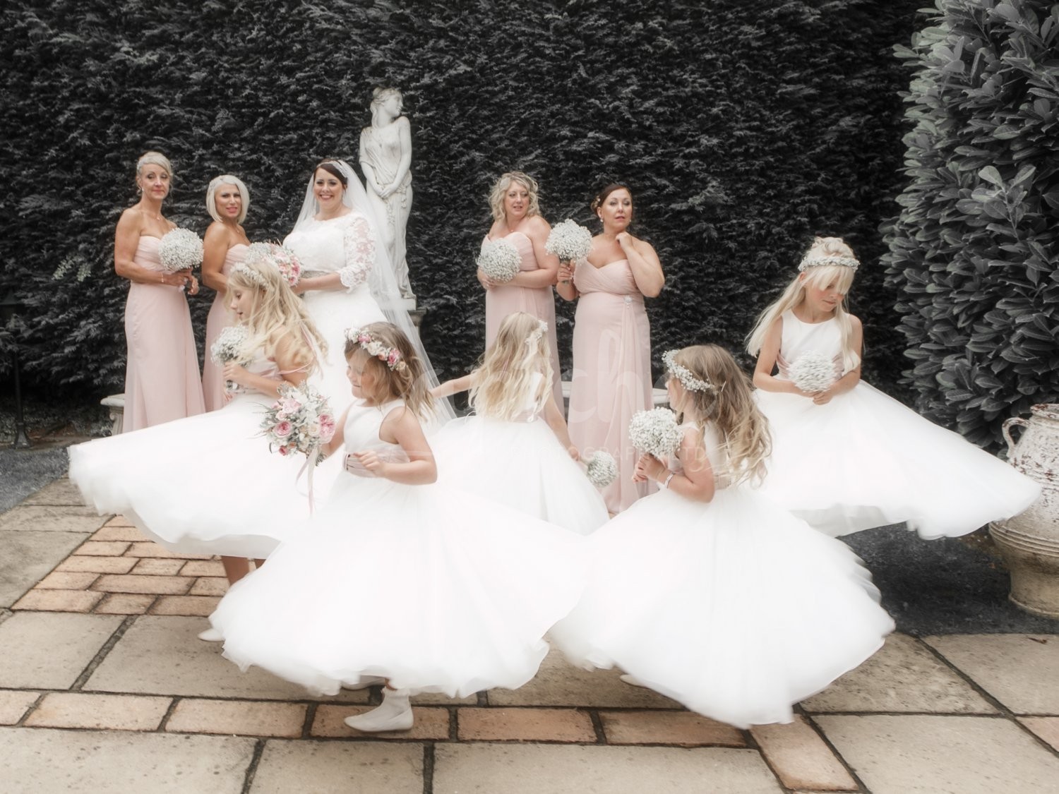 Its just as exciting as Christmas flowergirls, flowers in hair, spinning dresses, reportage, vintage, lace, wedding photography, Yew Lodge Hotel, Captcha Photography